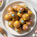 Cadbury egg protein balls recipe — no-bake protein bites with crushed Mini Eggs on a spring plate